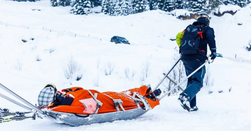 Personal injury lawyer from Utah, consulting a client about a snowboarding accident